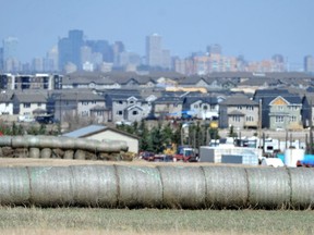 New housing encroaches on a farm on the south edge of the city in the Allard area as urban sprawl edges ever outwards like a cancer in Edmonton, Ab. on Wednesday May 8, 2013. A new study used 30 years of satellite data to track urbanization and farmland loss in the Edmonton-Calgary corridor.