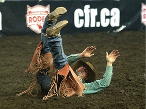 Jacob Stemo of Calgary busts out of the chute the 2013 Canadian Finals Rodeo at Rexall Place in Edmonton