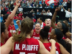 EDMONTON, ALTA: ¬†AUGUST 16, 2015 --  Canada celebrates a win over Cuba 82-66 for the gold at the FIBA Americas Women's Basketball tournament in Edmonton. August 16, 2015. (Photo by Bruce Edwards / Edmonton Journal)