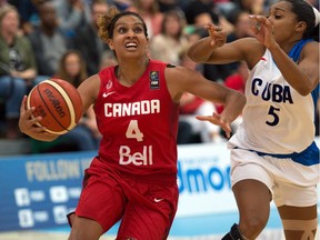 EDMONTON, ALTA: ¬†AUGUST 16, 2015 -- Miah-Marie Langlois (4) (l), and Ineidis Casanova (5). Canada beats Cuba 82-66 for the gold at the FIBA Americas Women's Basketball tournament in Edmonton. August 16, 2015. (Photo by Bruce Edwards / Edmonton Journal)