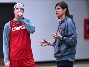 Canadian Women's National Basketball team head coach Lisa Thomaidis with player Katherine Plouffe during a practice session at the Saville Centre in Edmonton.