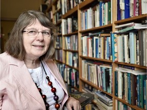 University of Alberta professor Margaret Mackey with her book, One Child Reading: My Auto-Bibliography.