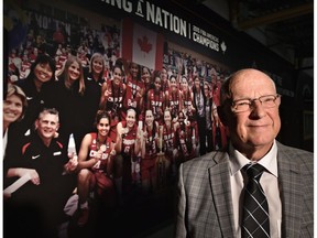 EDMONTON, ALTA: MAY 27, 2016 -- One of the main organizers, Bob Butlin, executive director of Edmonton Grads standing next to a new photo mural celebrating women in sport was unveiled depicting the 2015 FIBA Americas Champions, Canada's Basketball Senior Women's National Team, at the Saville Centre in Edmonton, May 27, 2016. (ED KAISER/PHOTOGRAPHER)