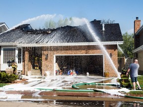 EDMONTON, ALTA: MAY 8, 2016 -- A home at 212 Wolf Ridge Close burns in Edmonton, Alta., on Sunday, May 8, 2016. (CODIE MCLACHLAN/EDMONTON JOURNAL)