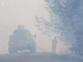 Fire crews battled a Wolf Willow wildfire in Edmonton on May 8, 2016. Embers blown by high winds did serious damage to three nearby homes. It was the most serious of 217 brush and grass fires the Edmonton fire department has battled so far this month.