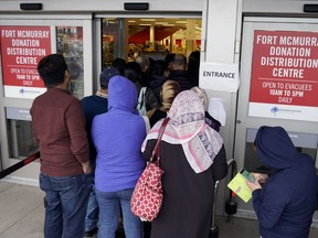 Hundreds of people displaced by the wildfire in Fort McMurray lined up at the Fort McMurray Donation Distribution Centre in Kingsway Mall on Friday May 27, 2016.