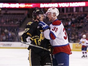 Edmonton's Brett Pollock (39) and Brandon's Reid Duke (27) push and shove during the third period of a WHL playoff game between the Edmonton Oil Kings and the Brandon Wheat Kings at Rexall Place in Edmonton on March 31, 2016. (Ian Kucerak)