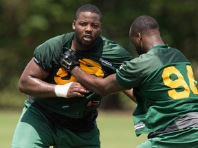 Eskimos' defensive lineman Daniel Ross (96), left and Kaelin Burnett (94) run through drills during the mini-camp at Historic Dodgertown in Vero Beach on Sunday, April 17, 2016.