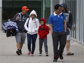 Evacuees from the Fort McMurray wildfires arrive at the evacuation centre in Edmonton on Thursday, May 5, 2016.