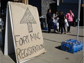 Evacuees from the Fort McMurray wildfires continue to arrive at the evacuation centre in Lac la Biche, Alta., Friday, May 6, 2016.