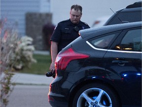 Edmonton police work at the scene of a fatal shooting near 286 Ozerna Rd. on Friday May 27, 2016.