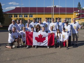 Members of Team Canada 2016 and Joint Task Force Ukraine following a 4-4 ball hockey game. (Supplied)