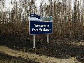 The welcome sign at south entrance to Fort McMurray on Highway 63 is still standing in this May 9, 2016, photo.