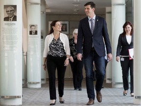 Regional Municipality of Wood Buffalo Mayor Melissa Blake walks through Edmonton City Hall with Edmonton Mayor Don Iveson. The Regional Municipality of Wood Buffalo held a special council meeting in a Committee Room at Edmonton City Hall Wednesday.