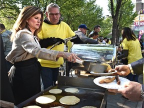Interim Conservative Leader Rona Ambrose joined other Alberta politicians Friday flipping pancakes at the Fort McMurray relief pancake breakfast. The event in downtown Edmonton raised more than $75,000 for the Red Cross.