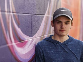 Fort McMurray evacuee Brandon Graburn is wondering if he'll get to attend his graduation ceremony from Holy Trinity High School after fleeing wildfires to stay in Edmonton, Alta., on Thursday May 12, 2016.