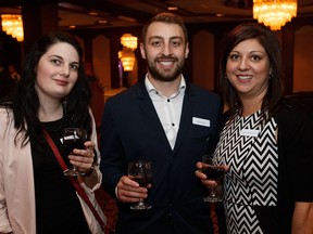 Courtney Larkan, left, Mike Lalli and Gabriella Aparicio pose together during the IABC Gala at the Chateau Lacombe in Edmonton on Thursday, May 26, 2016.