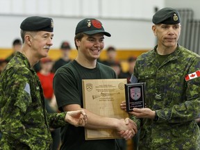 Junior Canadian Ranger Joel Waines receives second in the top shot category at the National Marksmanship Championship 2016 ceremonies at CFB Edmonton on May 19, 2016.