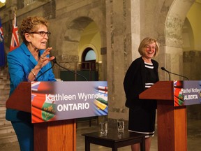 Ontario Premier Kathleen Wynne, left, and Alberta Premier Rachel Notley, right, hold a media availability to discuss an energy innovation partnership between Alberta and Ontario at the Alberta Legislature Building in Edmonton on Thursday, May 26, 2016.