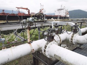 A ship receives its load of oil from the Kinder Morgan Trans Mountain Expansion Project's Westeridge loading dock in Burnaby, British Columbia, on June 4, 2015.