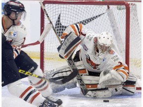 Lloydminster Bobcats goaltender Alex Leclerc reaches to cover the puck during the first period against the Carleton Place Canadians during the 2016 RBC Cup at the Centennial Civic Centre in Lloydminster on Monday. Eric Healey/Lloydminster Meridian Booster/Postmedia Network