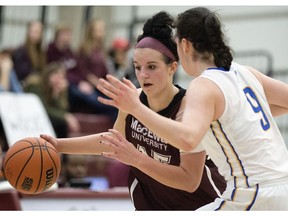 MacEwan University Griffins' Kendall Lyon (15) battles the University of Victoria Vikes' Kristy Gallagher (9) during first half Canada West basketball action at MacEwan University, in Edmonton Alta. on Saturday March 5, 2016. MacEwan won 77-62. Photo by David Bloom