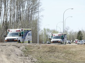 Ambulances head south near Gregoire Lake, near Anzac, Alta., on Wednesday May 4, 2016. A mass evacuation of Fort McMurray was held after a large wildfire struck the city.