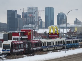 An train runs down the Metro LRT Line in Edmonton on Dec. 14, 2015.  The problem for the city now is that the trains still can not as of May 2016  go at significant speed through level crossings due to safety concerns.