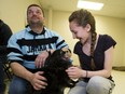 Dan Scharfl and his step-daughter Makayla Haffen are reunited with her dog Ella at the Alberta SPCA on May, 12 2016 in Edmonton. Makayla lived with her father in Fort McMurray but was not able to rescue their dogs before the wildfire destroyed their home. They are not sure how the dogs were rescued.