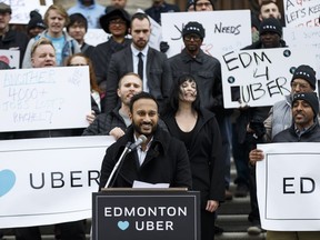 Uber Alberta general manager Ramit Kar speaks at a pro Uber rally on the steps of the Alberta Legislature in Edmonton, Alta., on Saturday February 27, 2016.