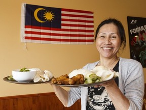 Vivian Tang dish shows her restaurant's sambal prawn (left) and nasi lemak dishes at Island Café and Bistro.