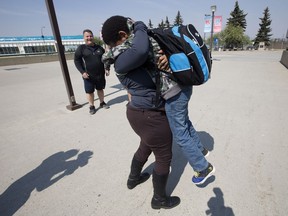 Priscillah Moatshe is reunited with her son Ryan, 12, at the evacuation centre at the Edmonton Expo Centre on May 6, 2016. Mother and son were separated because of the Fort McMurray wildfire for nearly four days.