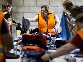 Volunteers sort donations for the Fort McMurray wildfire evacuees at the donation drop-off warehouse on 98th Street on May 16, 2016. A letter writer from Fort McMurray says Edmonton has gone out of its way to make Fort McMurrayites feel at home.