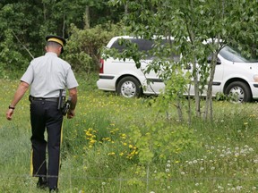 Sherwood Park RCMP investigate the wooded area where the remains of Shannon Collins were found in Strathcona County in June 2008.