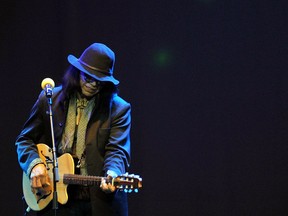 Sixto Rodriguez performs on stage at Carnival City, near Johannesburg, South Africa in 2013.