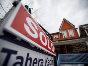 A sold sign marks a home sale in Toronto on March 7, 2016.