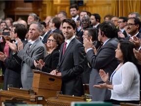 Prime Minister Justin Trudeau is applauded in the House of Commons on May 18, 2016, as he formally apologizes for a 1914 government decision that barred most of the passengers of the Komagata Maru from entering Canada.