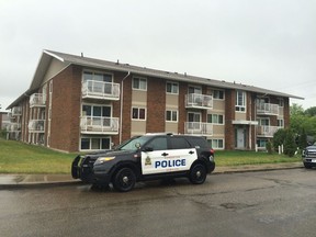 Police investigate the scene of a suspicious death at an apartment near 82 Street and 123 Avenue.