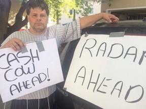 Edmontonian Jack Shultz, 42, created signs to warn drivers about hidden photo radar vans and got a $543 fine for stunting.