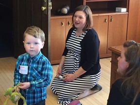 Associate Health Minister Brandy Payne (right) announced Monday that the Alberta government will help families cover most of the cost of Neocate, a special formula for infants and toddlers like three-year-old Isaac Caskenette, who have complex food allergies and medical conditions.