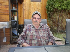 Steve Yurkiw, 67, sits at his cabin north of Lac La Biche. After losing his Beacon Hill home, he is debating if he should return to Fort McMurray.