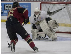 West Kelowna Warriors Liam Blackburn stick handles the puck outside the crease of Trenton Golden Hawks goaltender Jackson McIntosh prior to scoring the game-winning goal during a shootout at the 2016 RBC Cup at the Centennial Civic Centre on Tuesday, May 17, 2016 in Lloydminster, Sask. Eric Healey/Lloydminster Meridian Booster/Postmedia Network