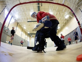 A shot gets past goalie Kenny Gayford while taking part in a floor hockey game at the Boyle Street Community League.