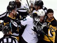 Sidney Crosby (87) of the Pittsburgh Penguins fights with Tommy Wingels (57) of the San Jose Sharks during the second period in Game 5 of the 2016 NHL Stanley Cup Final at Consol Energy Center on June 9, 2016, in Pittsburgh, Penn.