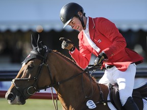 Ben Asselin riding Makavoy during the BMO Nations' Cup at the Spruce Meadows 'Masters' 2014.