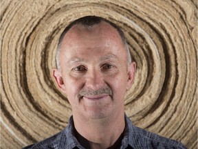 Dan Madlung is the president and CEO of BioComposites Group. This photo, taken June 21, 2016, shows him in front of a roll of erosion control mat, made of hemp and wood, at the company's factory, in Drayton Valley, Alberta.