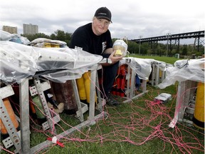 Brad Dezotell, the president of Fireworks Spectaculars, prepares the fireworks mortar racks on June 30, 2016, getting ready for the Canada Day display.
