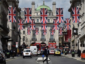 Union flags fly as banners across a street in central London on June 28, 2016. EU leaders attempted to rescue the European project and Prime Minister David Cameron sought to calm fears over Britain's vote to leave the bloc as ratings agencies downgraded the country. Britain has been pitched into uncertainty by the June 23 referendum result, with Cameron announcing his resignation, the economy facing a string of shocks and Scotland making a fresh threat to break away.