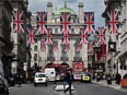 Union flags fly as banners across a street in central London on June 28, 2016. EU leaders attempted to rescue the European project and Prime Minister David Cameron sought to calm fears over Britain's vote to leave the bloc as ratings agencies downgraded the country. Britain has been pitched into uncertainty by the June 23 referendum result, with Cameron announcing his resignation, the economy facing a string of shocks and Scotland making a fresh threat to break away.