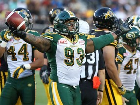 Edmonton Eskimos defensive tackle Don Oramasionwu (93) celebrates after gaining possession on a fumble by the Hamilton Tiger-Cats during the second half of CFL football action in Hamilton, Ontario on Saturday, September 19, 2015.